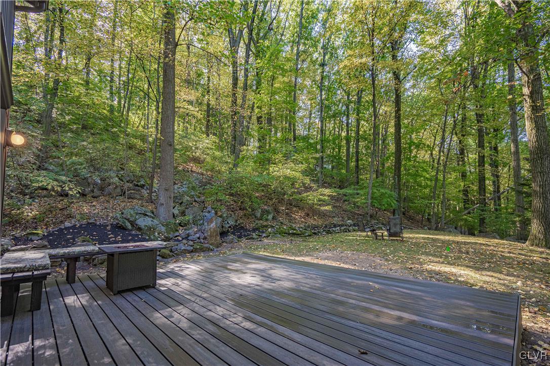 110 Mountain Park Road Allentown, PA 18103 - Photo 21 of 22 a view of a terrace with wooden floor and bench