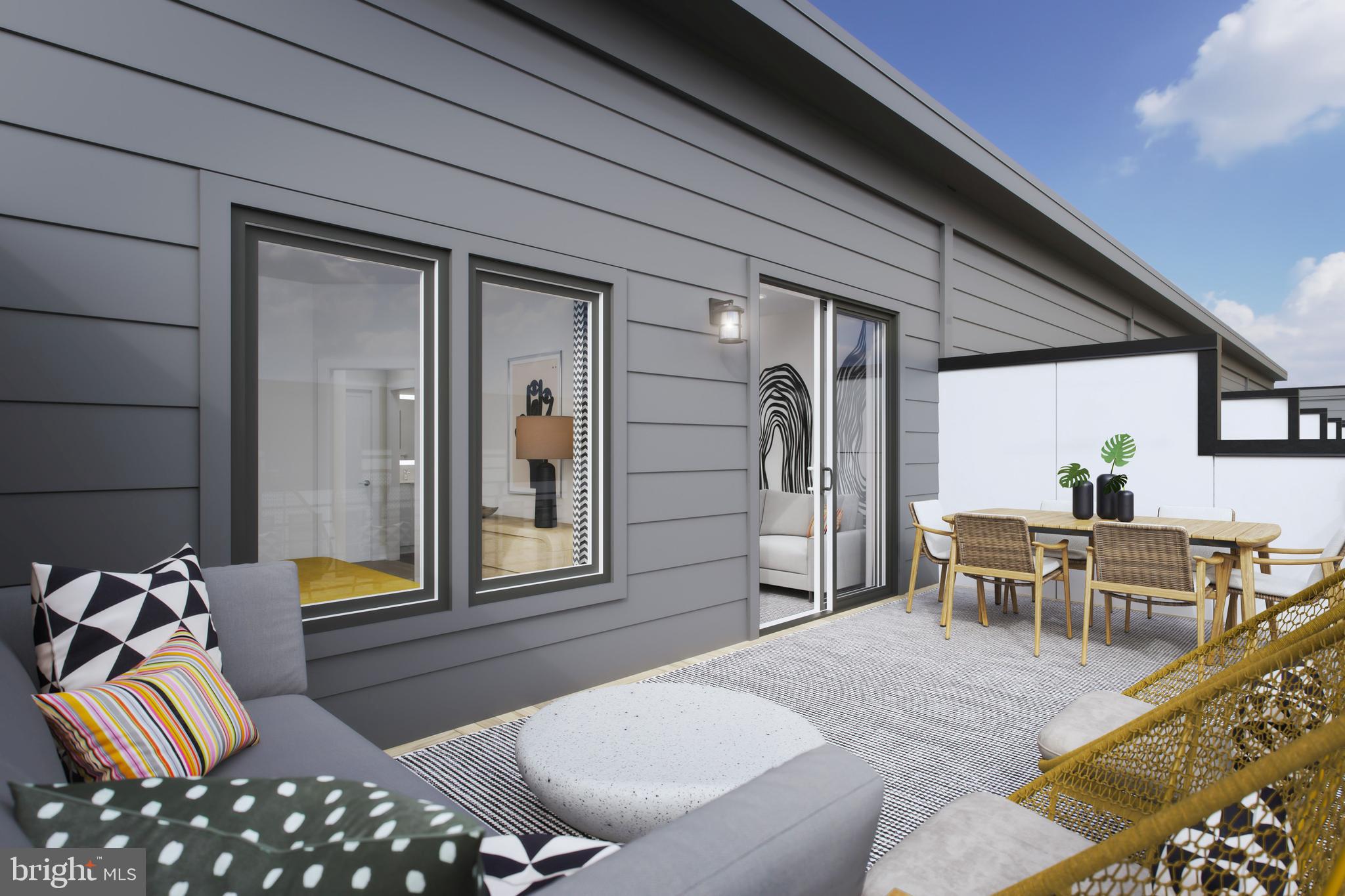 61 Lower Service Road Northwest, Unit POWELL 820 Washington, DC 20422 - Photo 12 of 12 a balcony with furniture and wooden floor