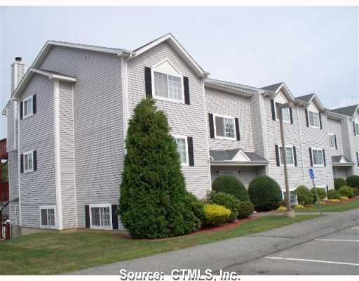 310 Boston Post Road, Unit 31 Waterford, CT 06385 - Photo 1 of 1 a front view of a house with a yard