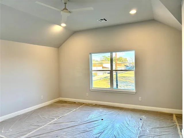 a spacious bathroom with a bathtub sink and mirror