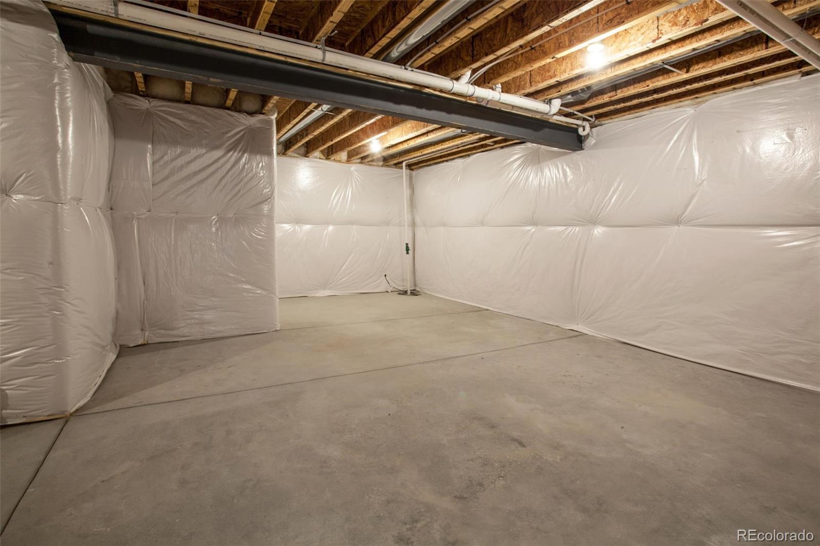 6768 Castello Street Timnath, CO 80547 - Photo 14 of 38 a view of a room with racks on the wall