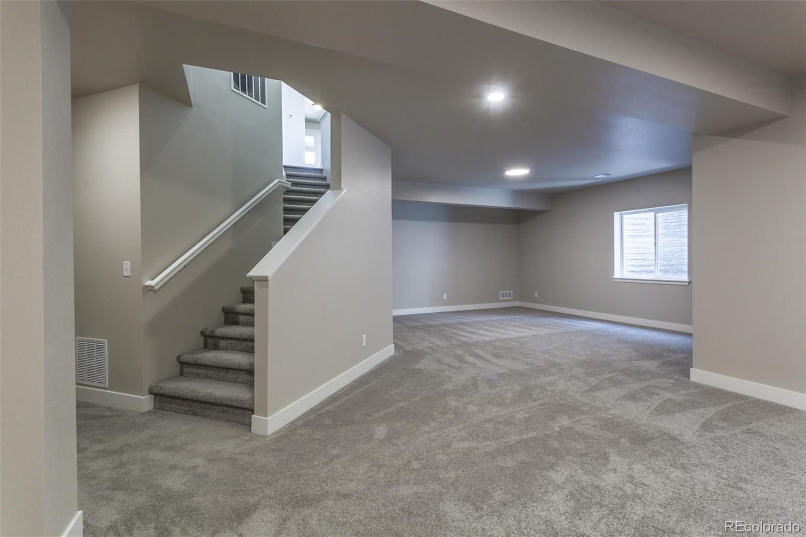 6768 Castello Street Timnath, CO 80547 - Photo 20 of 38 a view of an empty room with stairs