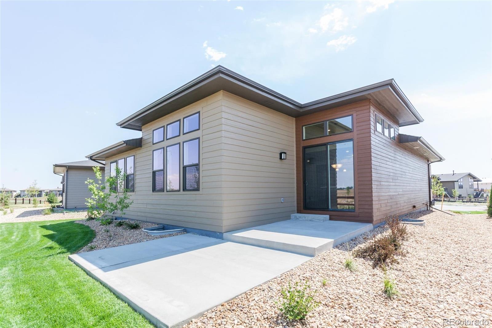 6768 Castello Street Timnath, CO 80547 - Photo 22 of 38 a front view of a house with a yard