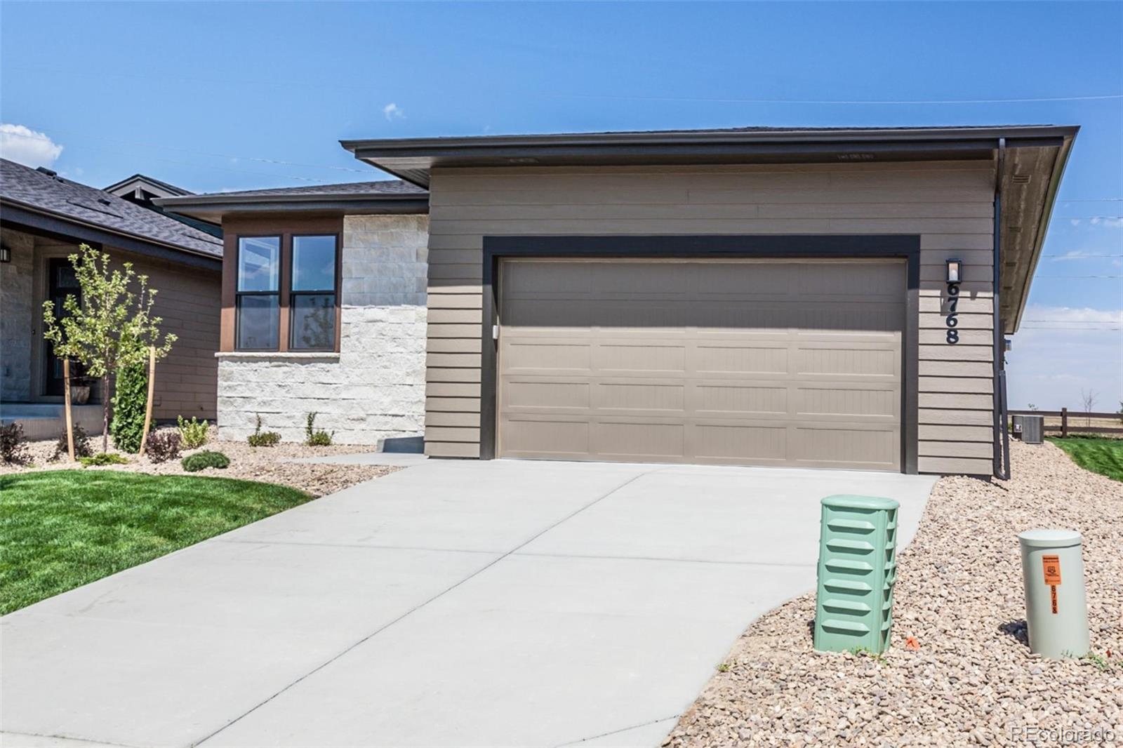 6768 Castello Street Timnath, CO 80547 - Photo 24 of 38 a front view of a house with a yard