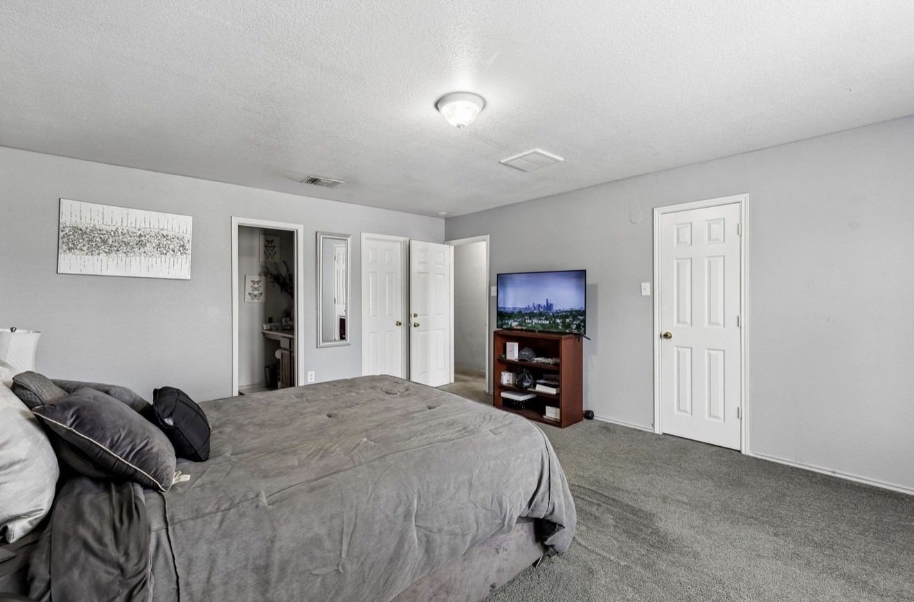 7118 Rising Brook Drive Cypress, TX 77433 - Photo 13 of 21 a bed room with a bed and a chair