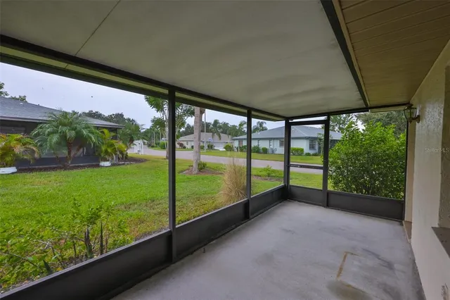 a view of a room with lots of wooden furniture