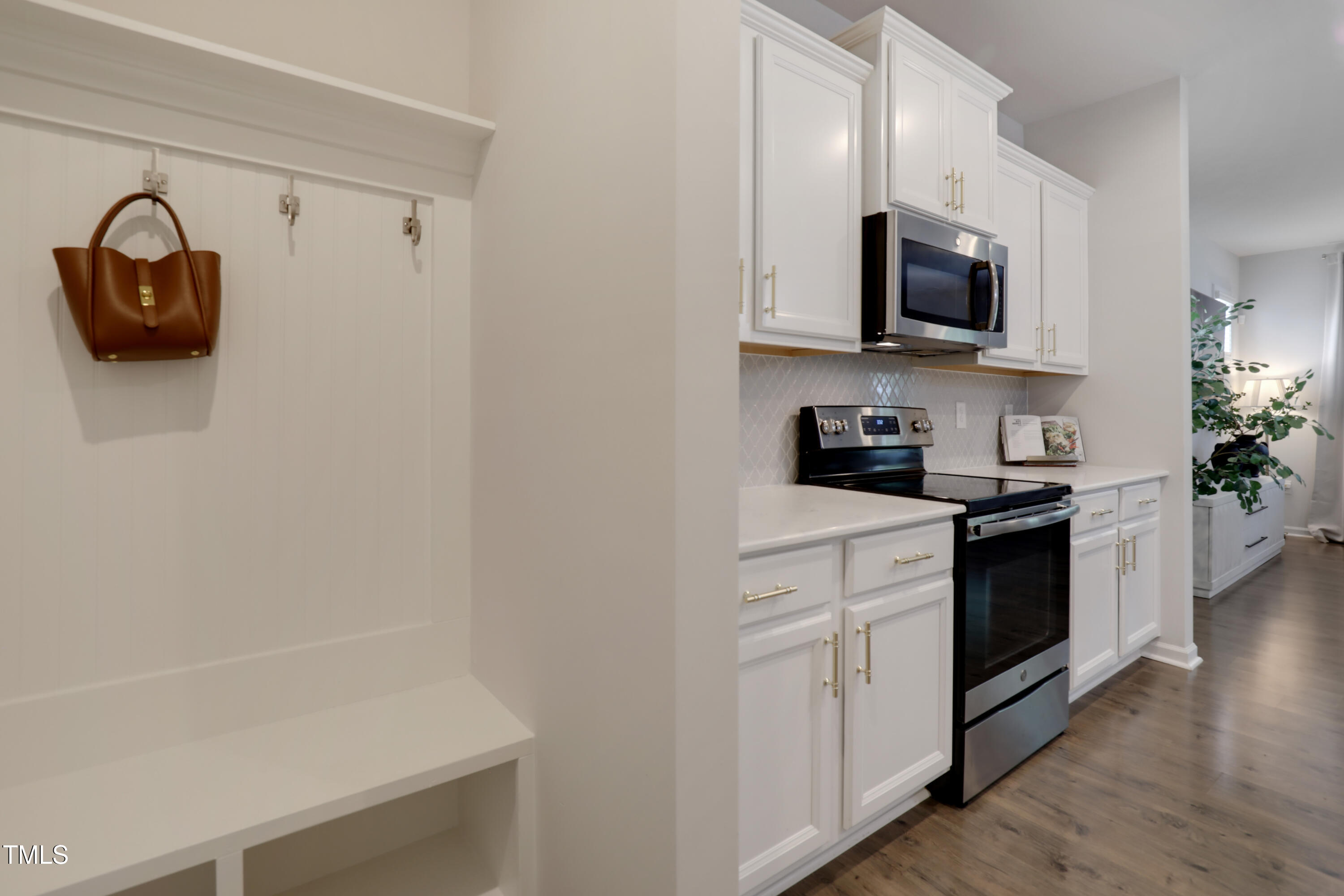 3636 Water Mist Lane Raleigh, NC 27604 - Photo 15 of 28 a kitchen with white cabinets and a stove