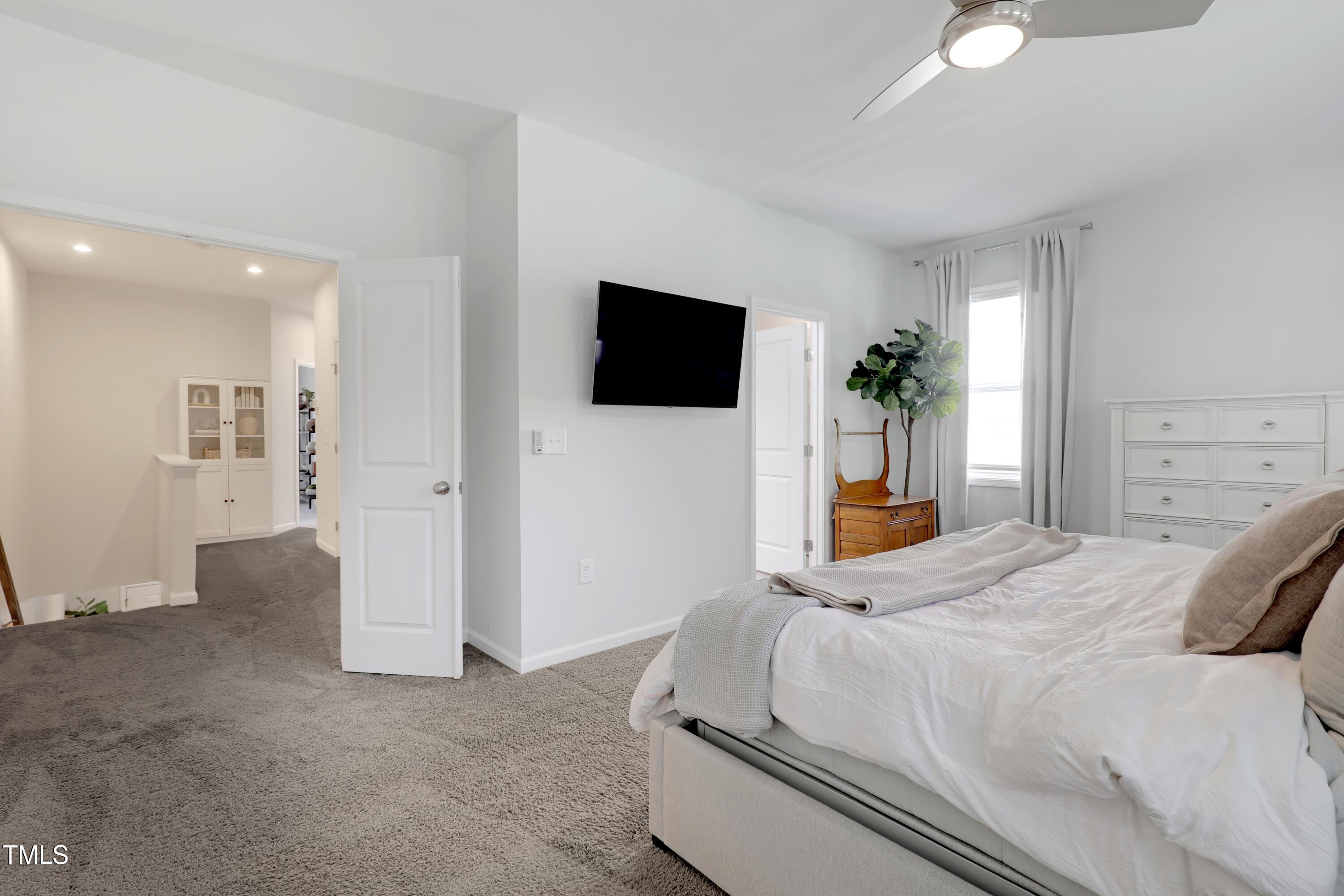 3636 Water Mist Lane Raleigh, NC 27604 - Photo 17 of 28 a bedroom with a bed and a flat screen tv