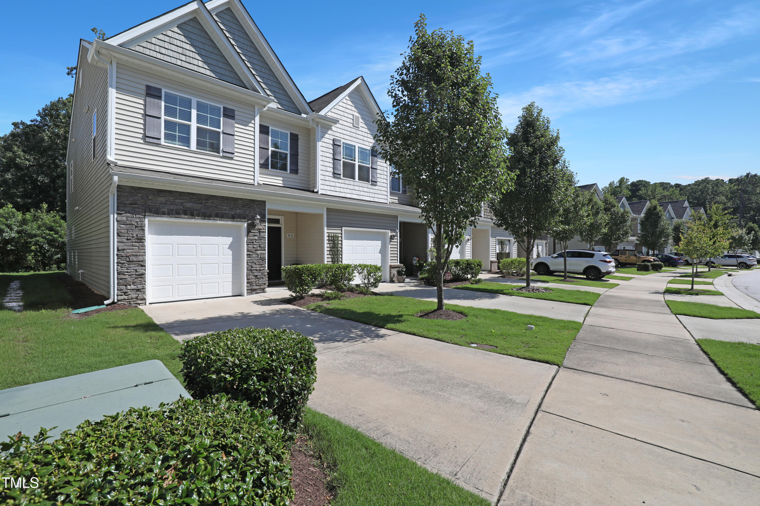 3636 Water Mist Lane Raleigh, NC 27604 - Photo 2 of 28 a front view of a house with a yard and garage