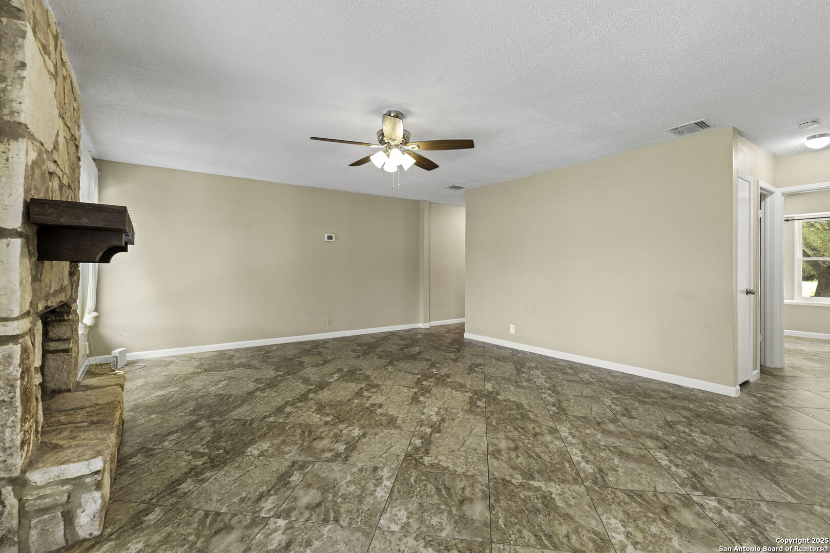 5346 Binz Engleman Road Kirby, TX 78219 - Photo 9 of 28 wooden floor in an empty room