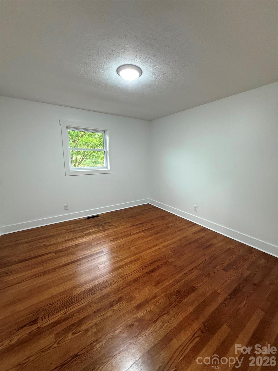 2677 Pax Hill Road Morganton, NC 28655 - Photo 14 of 15 a view of empty room with wooden floor
