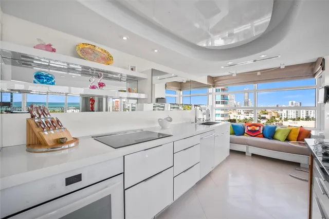 a kitchen with stainless steel appliances granite countertop a lot of counter space and a sink