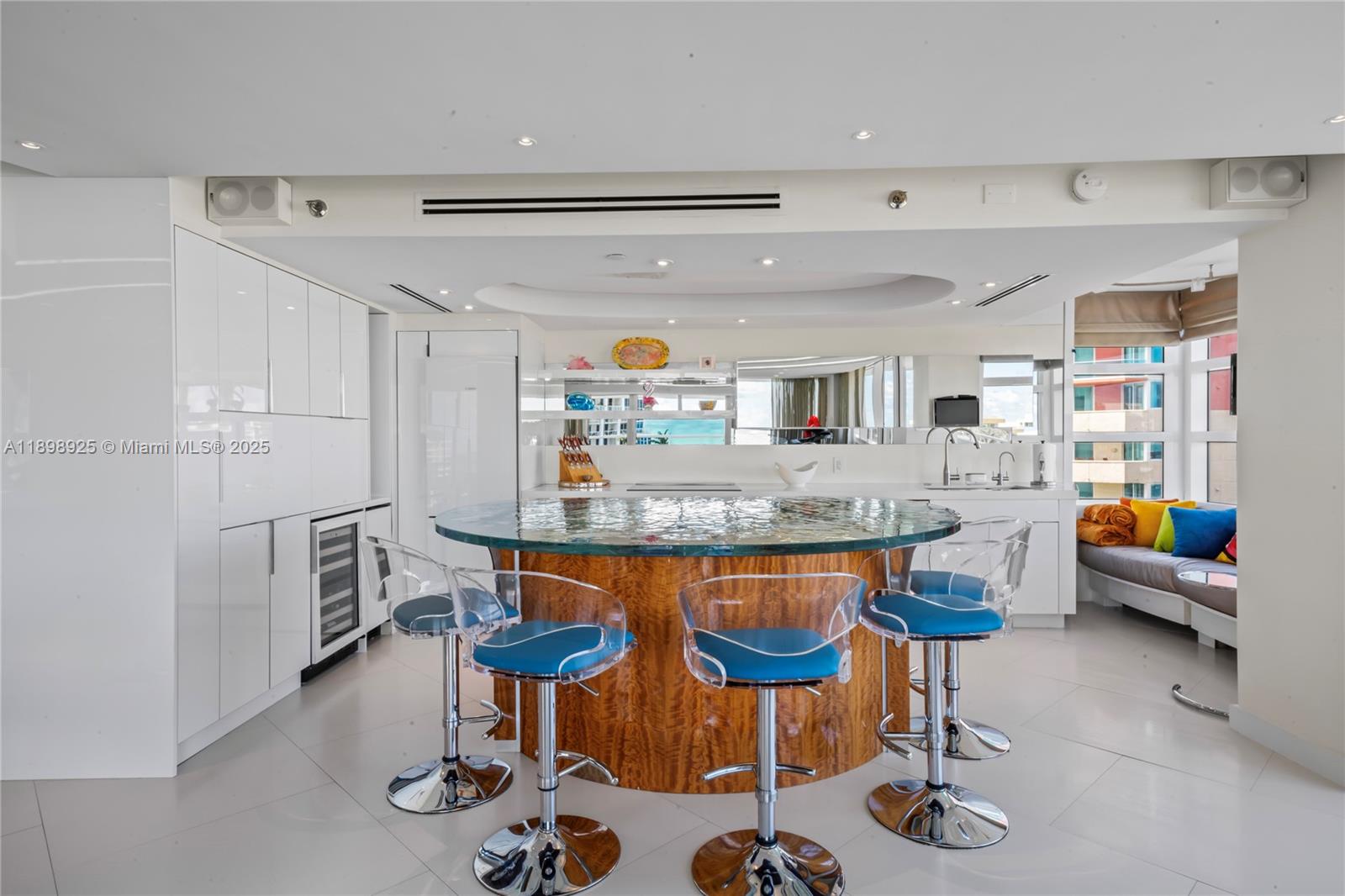 400 South Pointe Drive, Unit 910 Miami Beach, FL 33139 - Photo 17 of 44 a kitchen with stainless steel appliances granite countertop a sink and a refrigerator