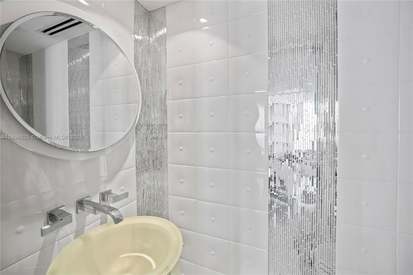 400 South Pointe Drive, Unit 910 Miami Beach, FL 33139 - Photo 20 of 44 a bathroom with a sink a toilet and shower