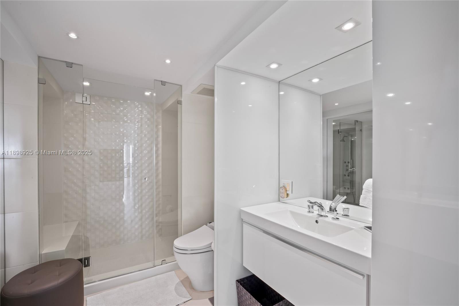 400 South Pointe Drive, Unit 910 Miami Beach, FL 33139 - Photo 32 of 44 a bathroom with a sink toilet and shower