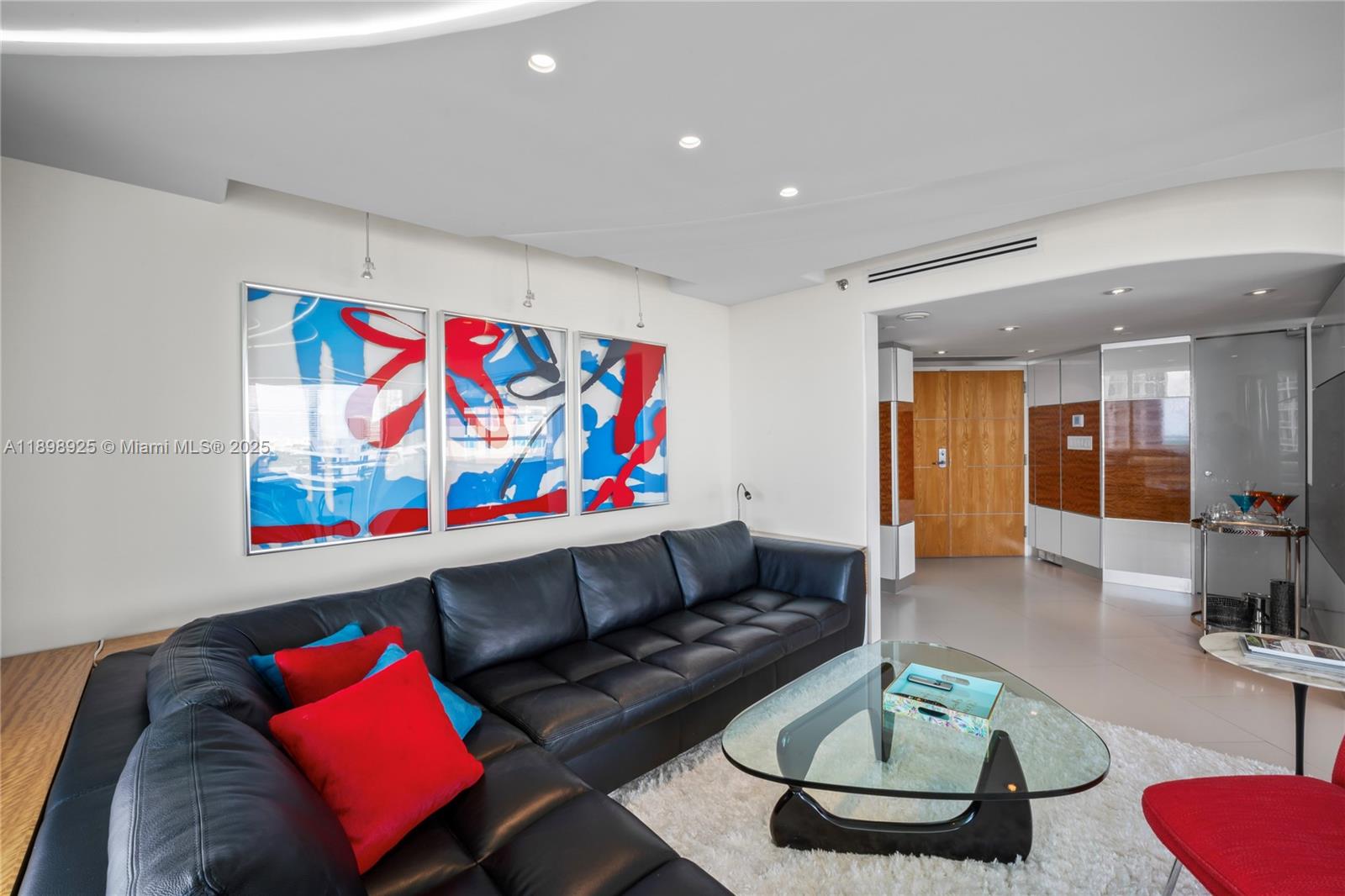 400 South Pointe Drive, Unit 910 Miami Beach, FL 33139 - Photo 7 of 44 a living room with furniture rug and couch