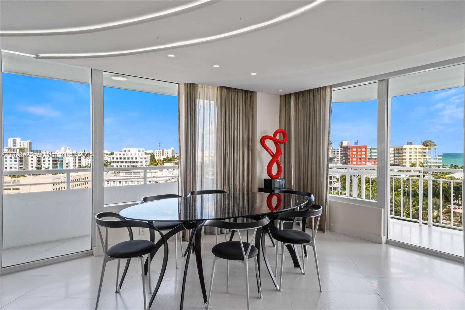 400 South Pointe Drive, Unit 910 Miami Beach, FL 33139 - Photo 9 of 44 a view of a dining room with furniture window and outside view