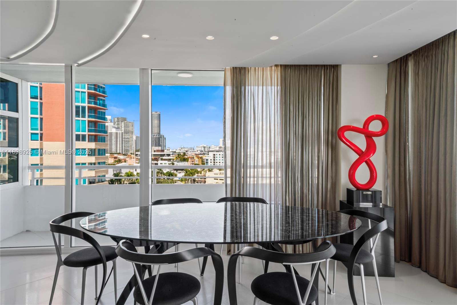 400 South Pointe Drive, Unit 910 Miami Beach, FL 33139 - Photo 10 of 44 a view of a dining room with furniture window and outside view