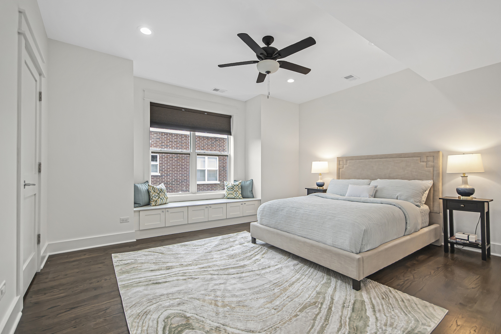 8146 Lincoln Avenue Skokie, IL 60077 - Photo 11 of 25 a bedroom with a large bed and a large window