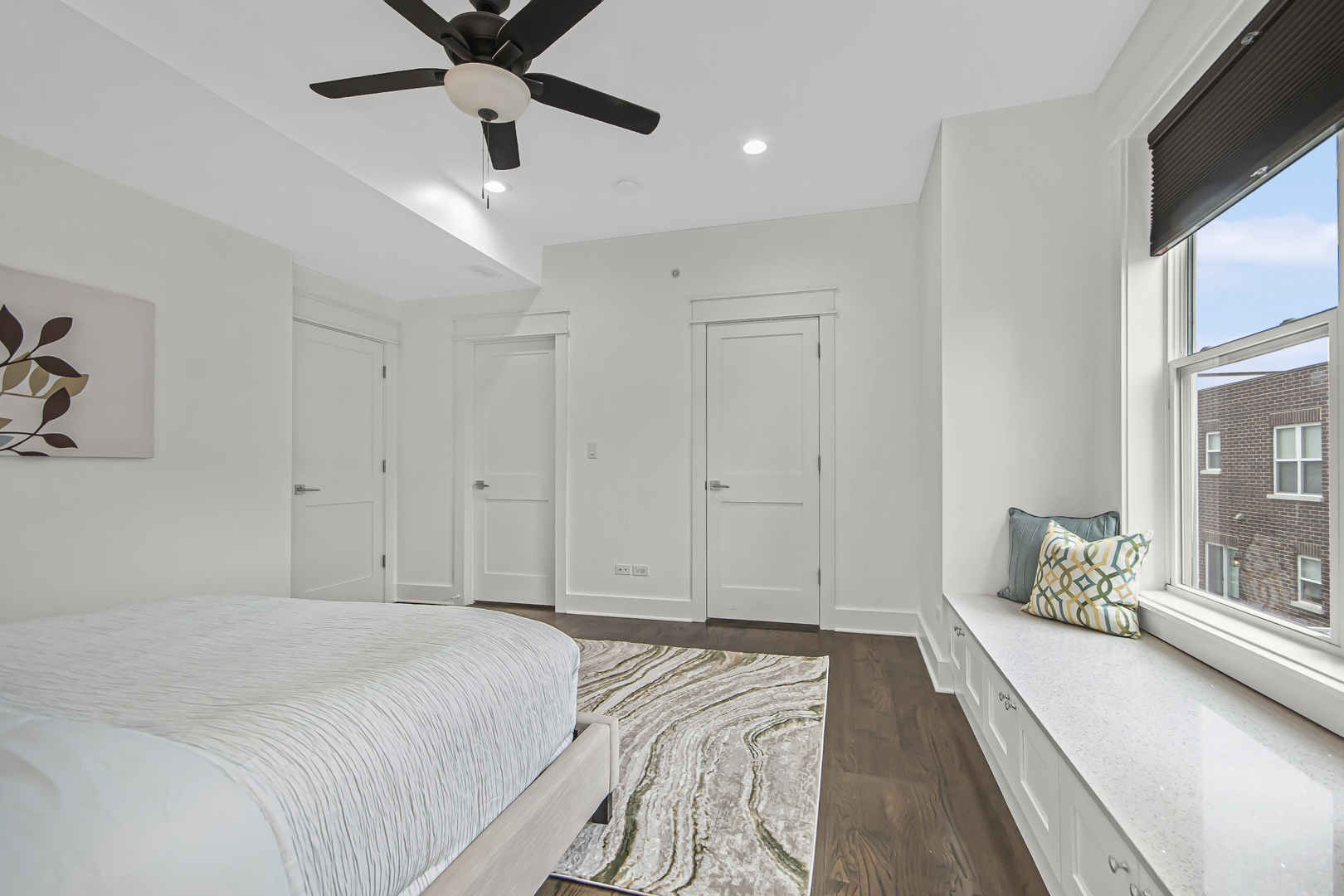 8146 Lincoln Avenue Skokie, IL 60077 - Photo 12 of 25 a spacious bedroom with a bed and a large window