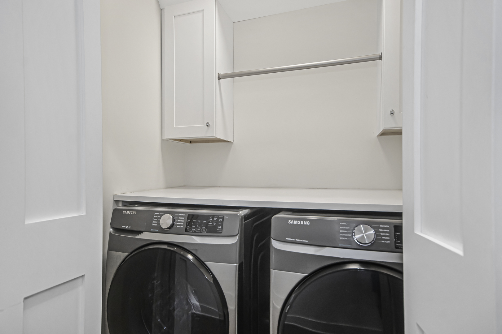 8146 Lincoln Avenue Skokie, IL 60077 - Photo 18 of 25 a utility room with dryer and washer