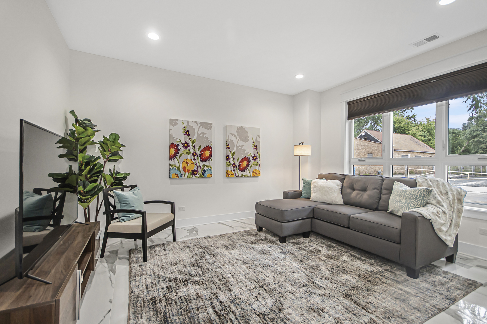 8146 Lincoln Avenue Skokie, IL 60077 - Photo 19 of 25 a living room with furniture and a large window