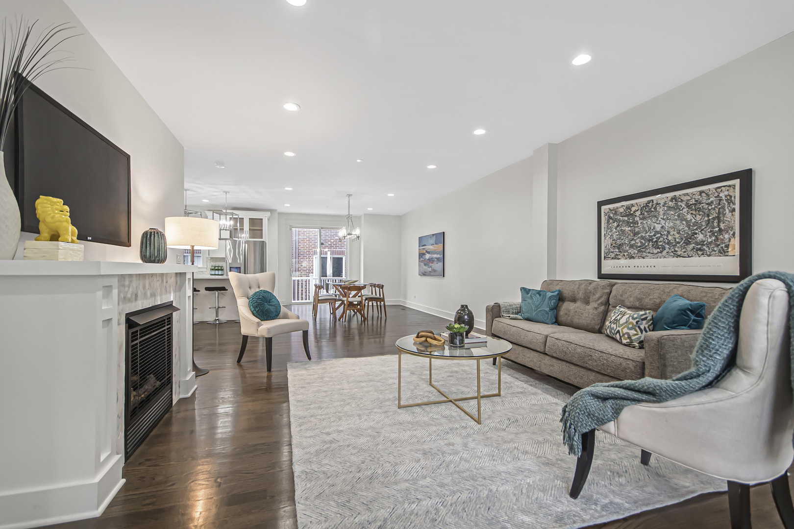 8146 Lincoln Avenue Skokie, IL 60077 - Photo 3 of 25 a living room with fireplace furniture and a flat screen tv