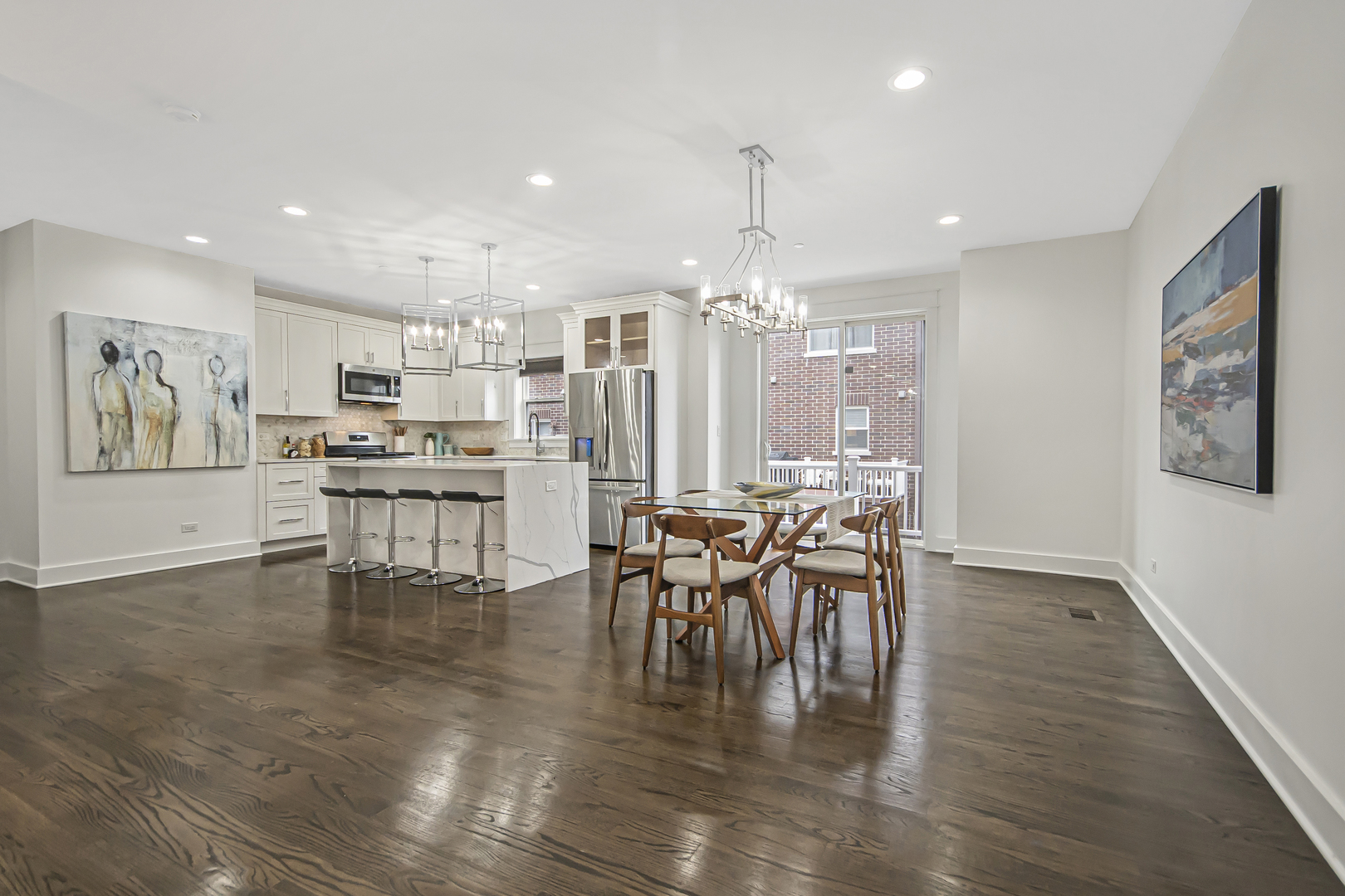 8146 Lincoln Avenue Skokie, IL 60077 - Photo 6 of 25 a dining room with kitchen island stainless steel appliances furniture a dining table and chairs