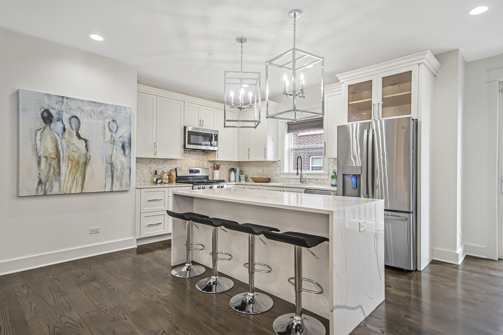 8146 Lincoln Avenue Skokie, IL 60077 - Photo 7 of 25 a kitchen with kitchen island a stove a refrigerator and a view of living room