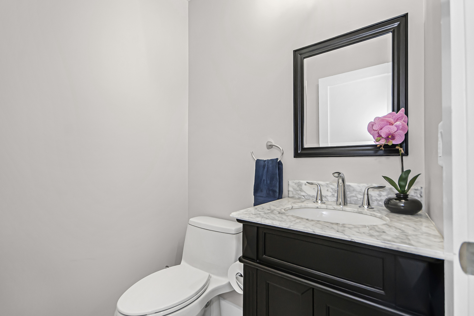 8146 Lincoln Avenue Skokie, IL 60077 - Photo 10 of 25 a bathroom with a granite countertop sink vanity mirror and toilet