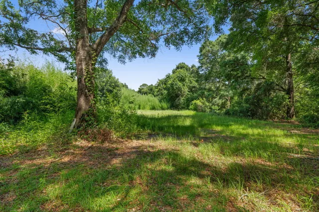a view of lake with a yard