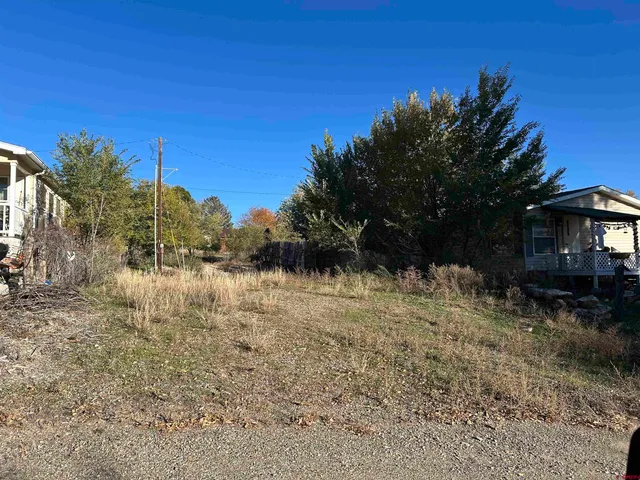 a view of a lake with a house in the background