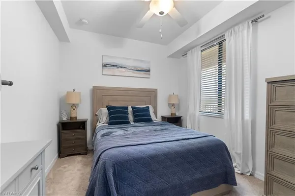 a bedroom with a bed and a fireplace