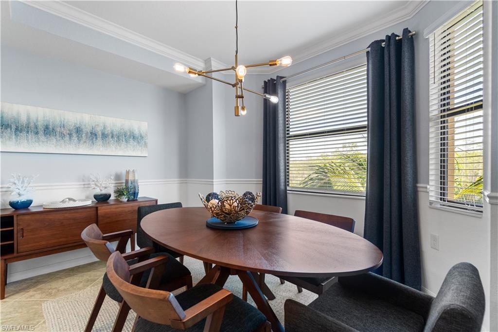 9590 Trevi Court, Unit 5337 Naples, FL 34113 - Photo 7 of 14 a view of a dining room with furniture and window