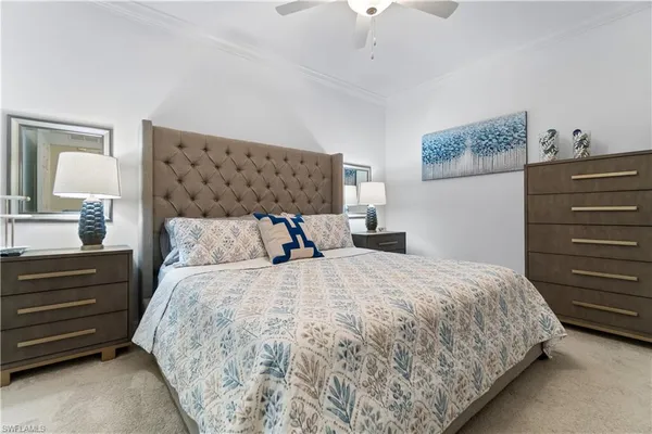 a bedroom with a bed and lamp