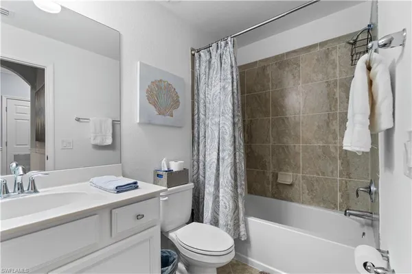 a bathroom with a sink a toilet and a bathtub