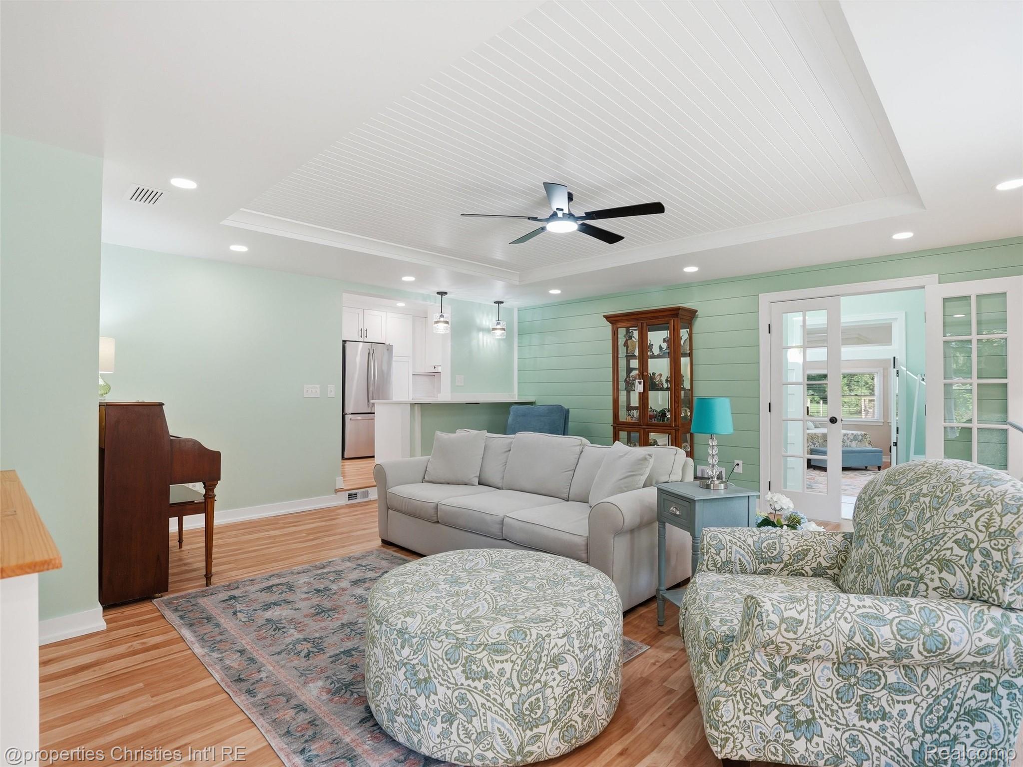 8645 Toma Road Pinckney, MI 48169 - Photo 19 of 65 Great Room with view to kitchen and foyer and primary suite