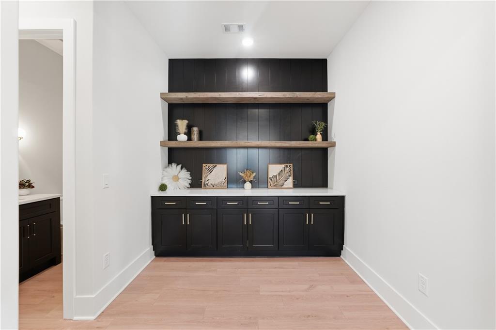 157 Palisade Drive Rydal, GA 30171 - Photo 20 of 68 a room with wooden cabinets and vanity