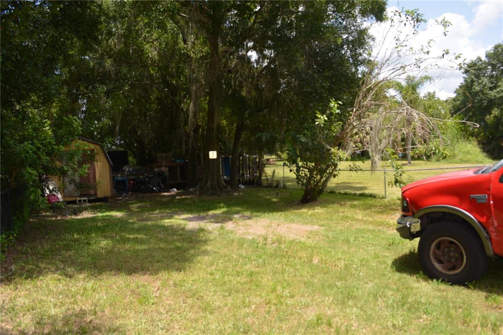 0 Main Street Sanford, FL 32771 - Photo 2 of 4 a view of a yard with car parked