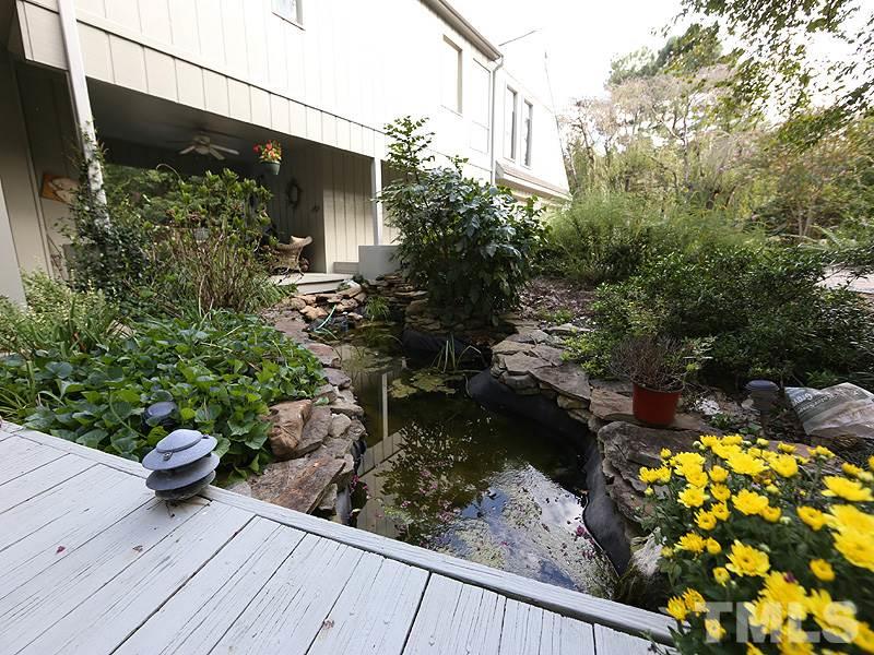 9620 Barton Creek Road Raleigh, NC 27615 - Photo 2 of 23 a view of a backyard with plants