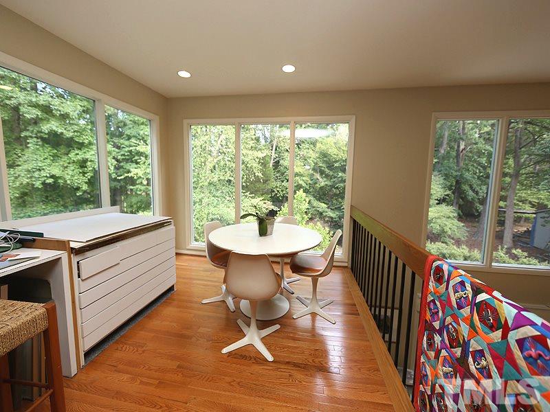 9620 Barton Creek Road Raleigh, NC 27615 - Photo 16 of 23 a view of a dining room with furniture window and wooden floor