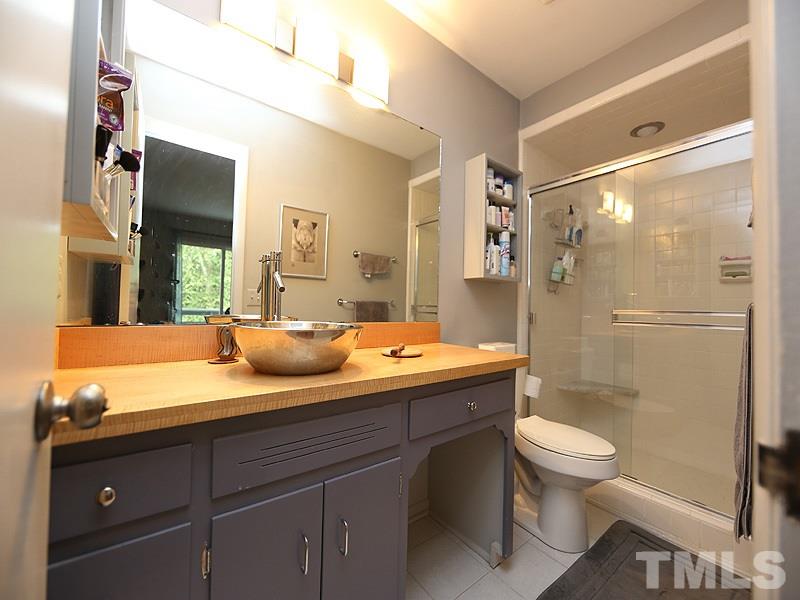 9620 Barton Creek Road Raleigh, NC 27615 - Photo 17 of 23 a bathroom with a sink toilet and shower
