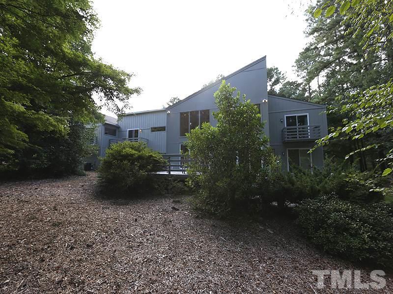 9620 Barton Creek Road Raleigh, NC 27615 - Photo 21 of 23 a view of a house with backyard and garden