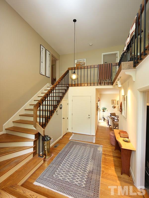 9620 Barton Creek Road Raleigh, NC 27615 - Photo 4 of 23 a view of entryway and hall with wooden floor