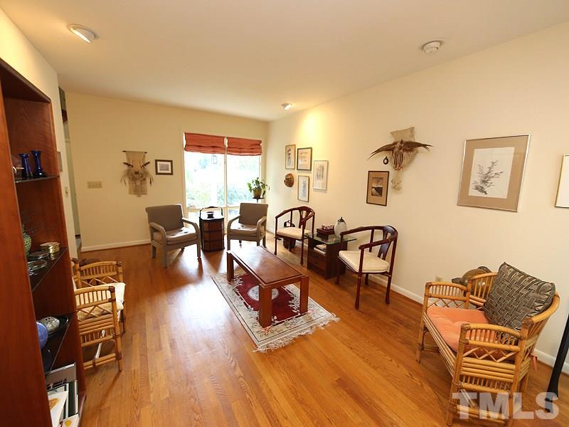9620 Barton Creek Road Raleigh, NC 27615 - Photo 6 of 23 a living room with furniture and wooden floor