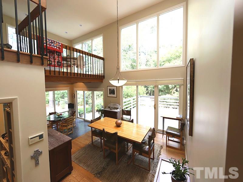 9620 Barton Creek Road Raleigh, NC 27615 - Photo 7 of 23 a view of a dining room with furniture window and wooden floor