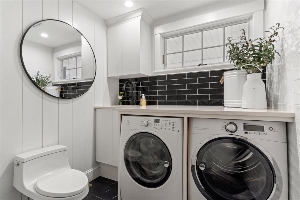 194 Merrymount Road Quincy, MA 02169 - Photo 21 of 32 a bathroom with a toilet a sink and mirror