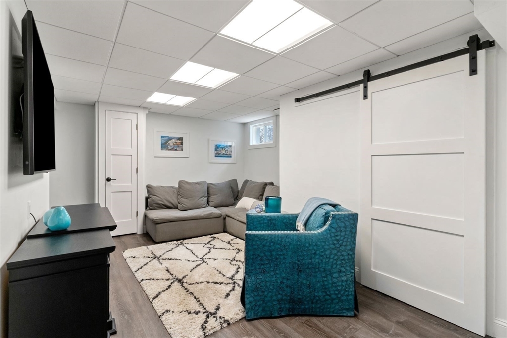 194 Merrymount Road Quincy, MA 02169 - Photo 24 of 32 a living room with furniture and a wooden floor