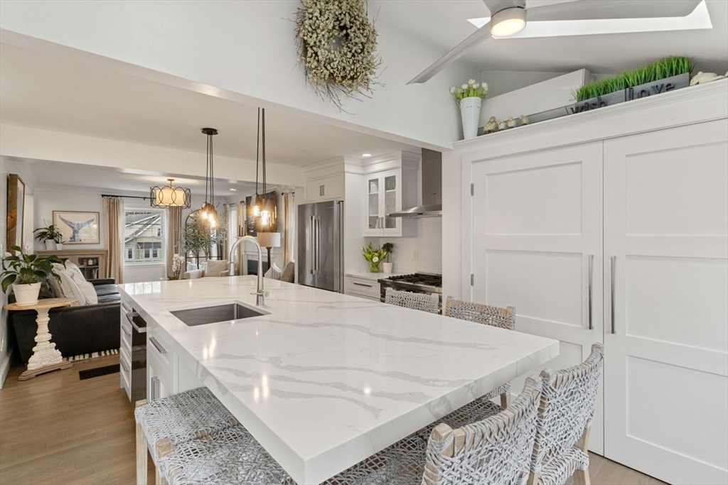 194 Merrymount Road Quincy, MA 02169 - Photo 9 of 32 a large white kitchen with a large island oven