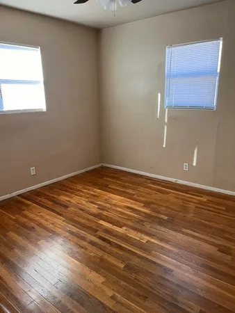 a white toilet sitting next to a bath tub